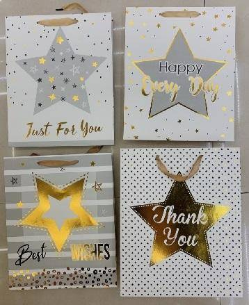 Torebka prezentowa elegancka gwiazdki złote 18x23 cm